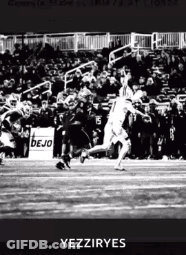 Man Holding Sign Saying Go Dukes GIF