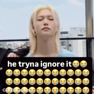Man Holding Sign Saying He Tryna Ignore It GIF