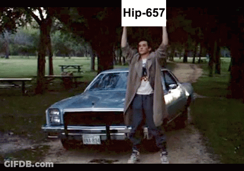 Man Holding Sign Saying Hip-657 In Front Of Car GIF