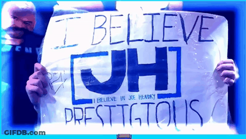 Man Holding Sign Saying I Believe Jh GIF