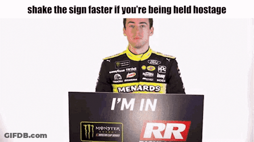 Man Holding Sign Saying I'm In GIF