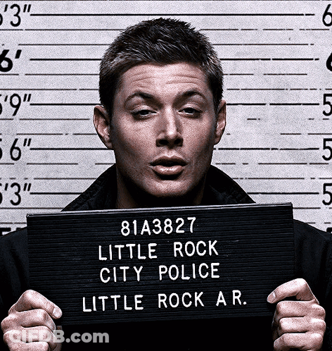 Man Holding Sign Saying Little Rock City Police GIF