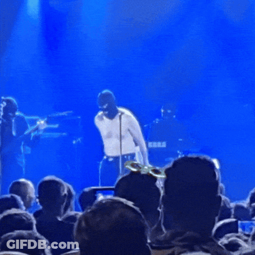 Man Holding Sign Saying Rack GIF