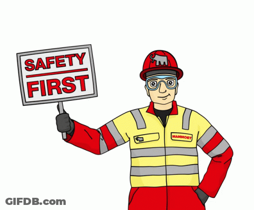 Man Holding Sign Saying Safety First GIF
