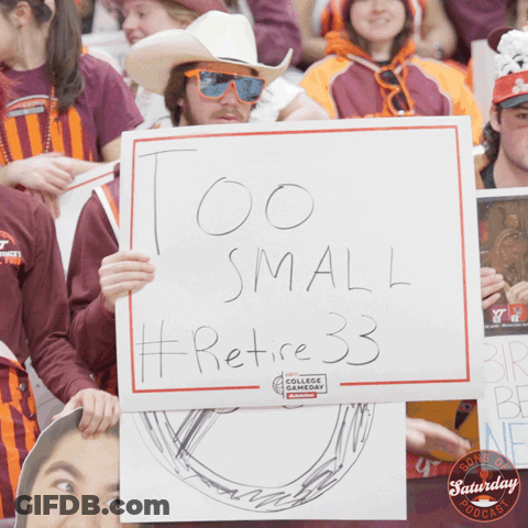 Man Holding Sign Saying Too Small Retire 33 GIF