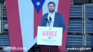 Man Holding Sign Saying Vance At Microphone GIF