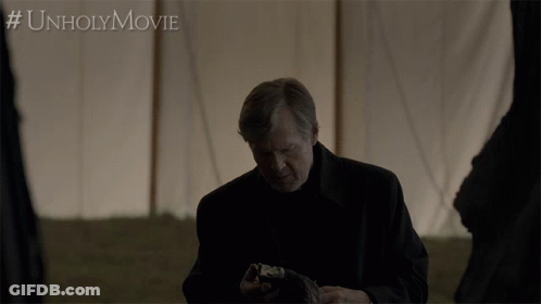 Man Holding Skull In Front Of Tent #Unholymovie GIF
