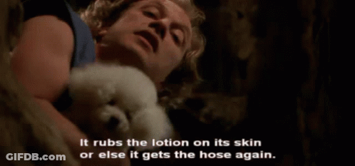 Man Holding Small White Dog GIF