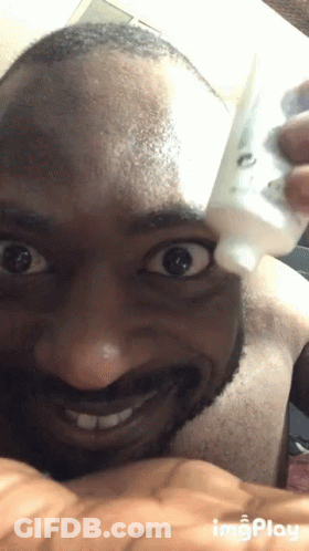 Man Holding Small White Dog GIF