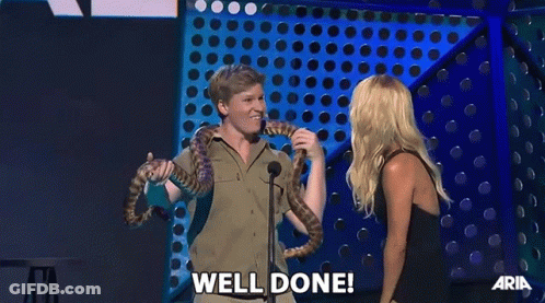 Man Holding Snake Woman Saying Well Done GIF