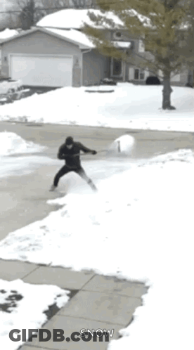 Man Holding Snowball GIF
