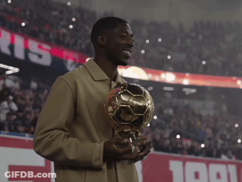 Man Holding Soccer Ball In Front Of Paris Sign GIF