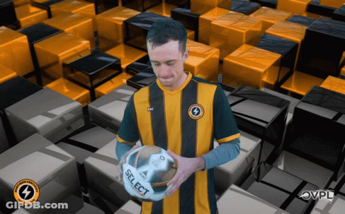 Man Holding Soccer Ball Saying Select GIF