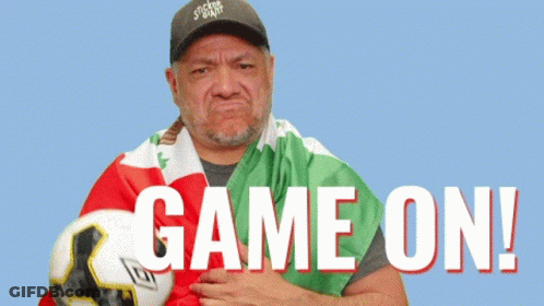 Man Holding Soccer Ball With Game On GIF