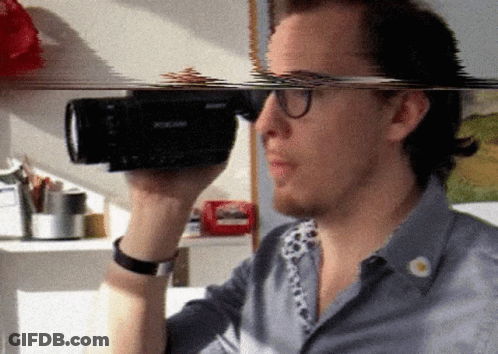 Man Holding Sony Camera GIF