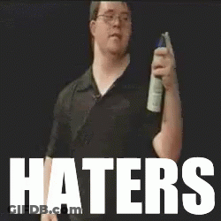 Man Holding Spray Bottle In Front Of Haters GIF