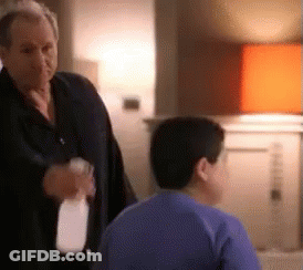 Man Holding Spray Bottle Talking To Boy GIF