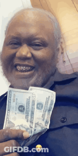 Man Holding Stack Of 20 Dollar Bills Smiling GIF