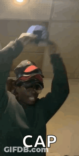 Man Holding Stack Of Hats GIF