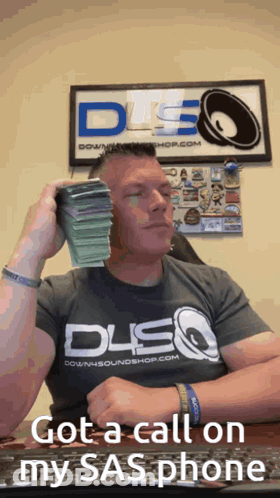 Man Holding Stack Of Money By DSQ Sign GIF