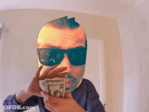 Man Holding Stack Of Money With Number 20 GIF