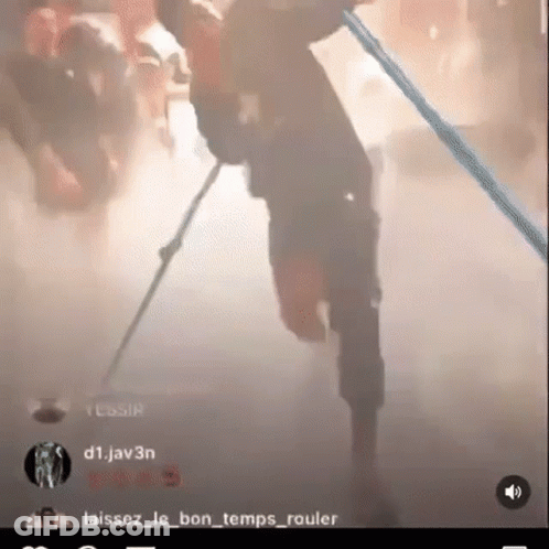 Man Holding Stick In Foggy Room GIF