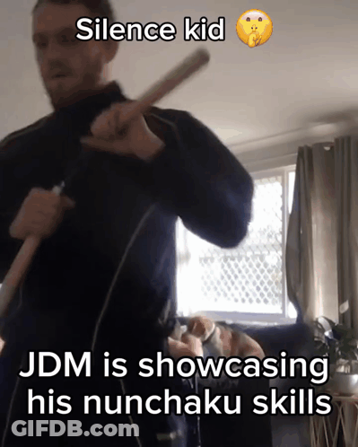 Man Holding Stick Saying Silence Kid GIF