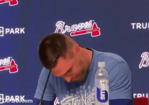 Man Holding Stuffed Animal At Microphone With Smart Water GIF