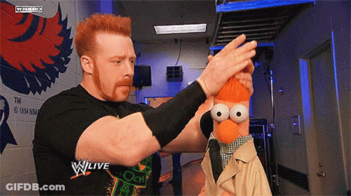Man Holding Stuffed Animal In Front Of W Live Sign GIF