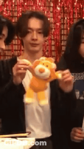 Man Holding Stuffed Animal GIF