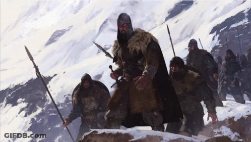 Man Holding Sword And Spear In Snow GIF