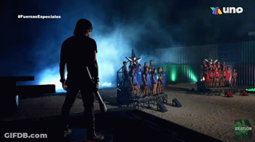Man Holding Sword In Front Of #Fuerzas Especiales Sign GIF