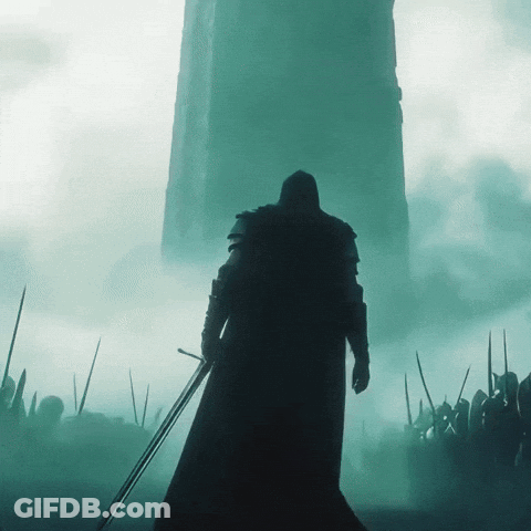 Man Holding Sword In Front Of Tower GIF