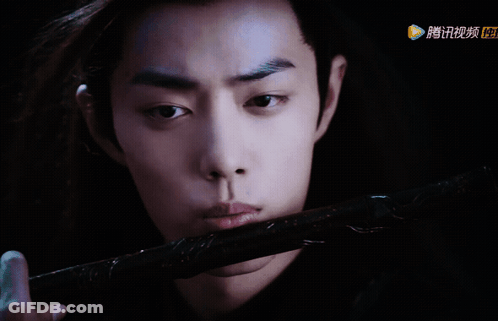 Man Holding Sword With Chinese Writing GIF
