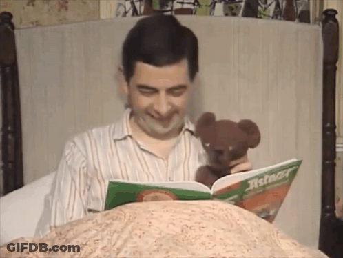 Man Holding Teddy Bear Reading Asterion GIF