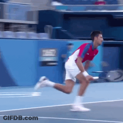 Man Holding Tennis Racquet Another Throwing Ball GIF
