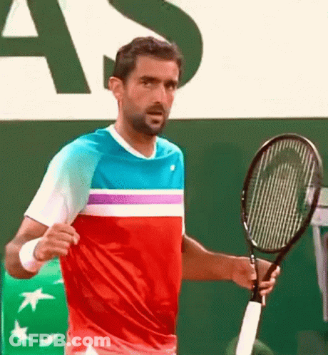Man Holding Tennis Racquet At Sign Saying As GIF
