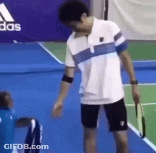 Man Holding Tennis Racquet GIF