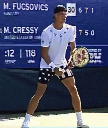 Man Holding Tennis Racquet By Scoreboard M. Fucsovics GIF