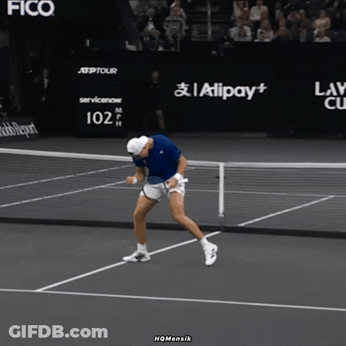 Man Holding Tennis Racquet In Front Of 102 Mph Sign GIF