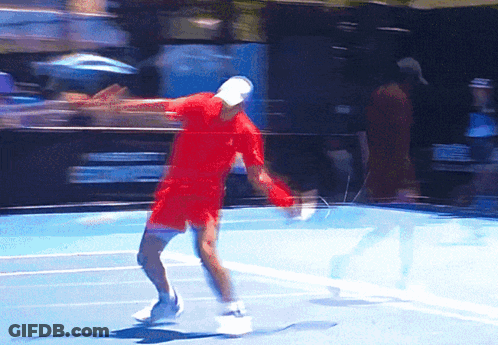 Man Holding Tennis Racquet In Front Of Emirates Ad GIF