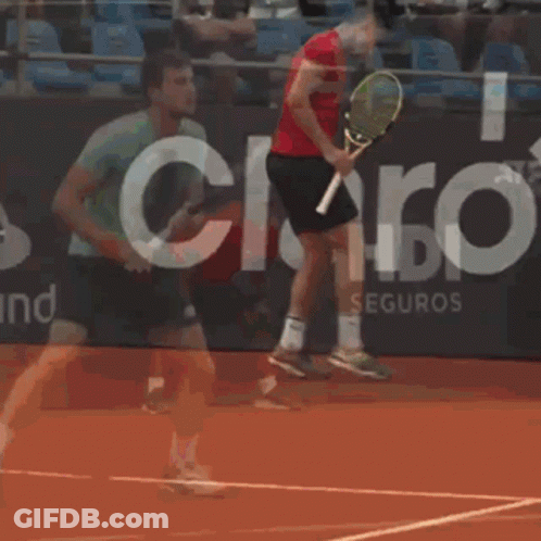 Man Holding Tennis Racquet In Front Of HDI Seguros Sign GIF