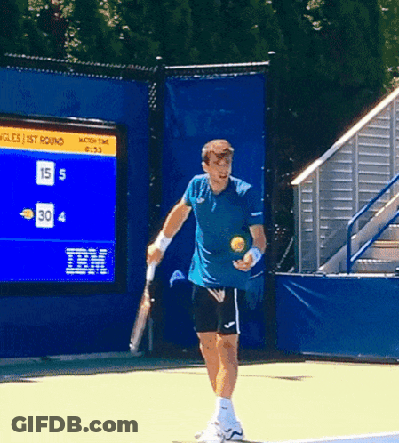 Man Holding Tennis Racquet In Front Of IBM Scoreboard GIF