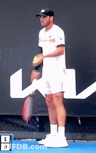 Man Holding Tennis Racquet In Front Of Sign Saying 1 0 GIF