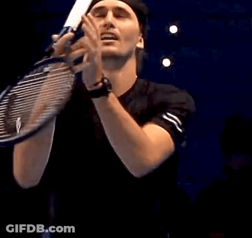 Man Holding Tennis Racquet In Mouth GIF