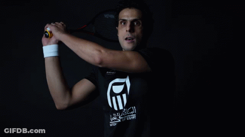 Man Holding Tennis Racquet In National Of Egypt Shirt GIF