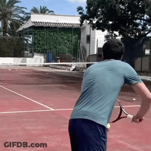 Man Holding Tennis Racquet On Court GIF