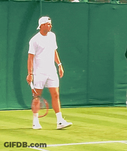 Man Holding Tennis Racquet On Court GIF