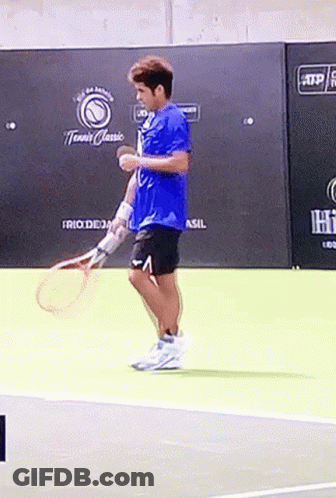 Man Holding Tennis Racquet On Court GIF