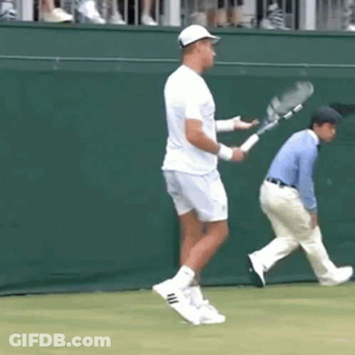 Man Holding Tennis Racquet On Court GIF